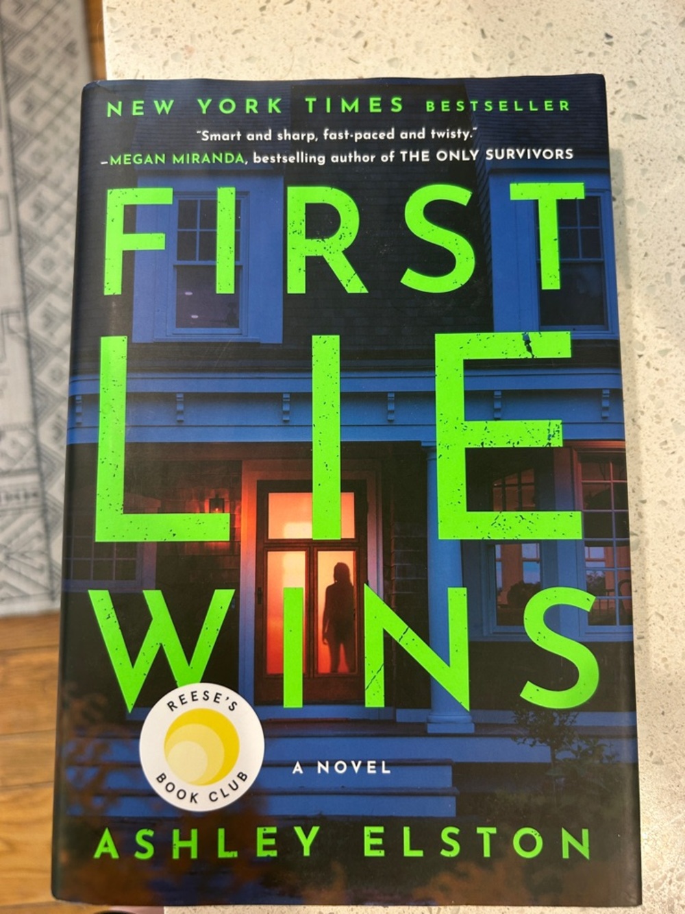 First Lie Wins by Ashley Elston - Neon Green & Blue Hardcover